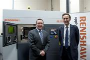 Lord Green in front of Renishaw 3D printing machine with Rhydian Pountney
