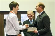 Renishaw apprentice Morgan Lloyd presents a 3D printed metal replica of Renishaw's 1802 mill building to HRH The Earl of Wessex
