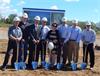 Renishaw Inc. President Leo Somerville (third from left) and members of the company’s senior executive management team break ground on a new facility