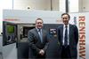 Lord Green in front of Renishaw 3D printing machine with Rhydian Pountney