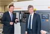 The Prime Minister and Neil Carmichael, MP for Stroud, with a Renishaw AM250 additive manufacturing (metal 3D printing) machine